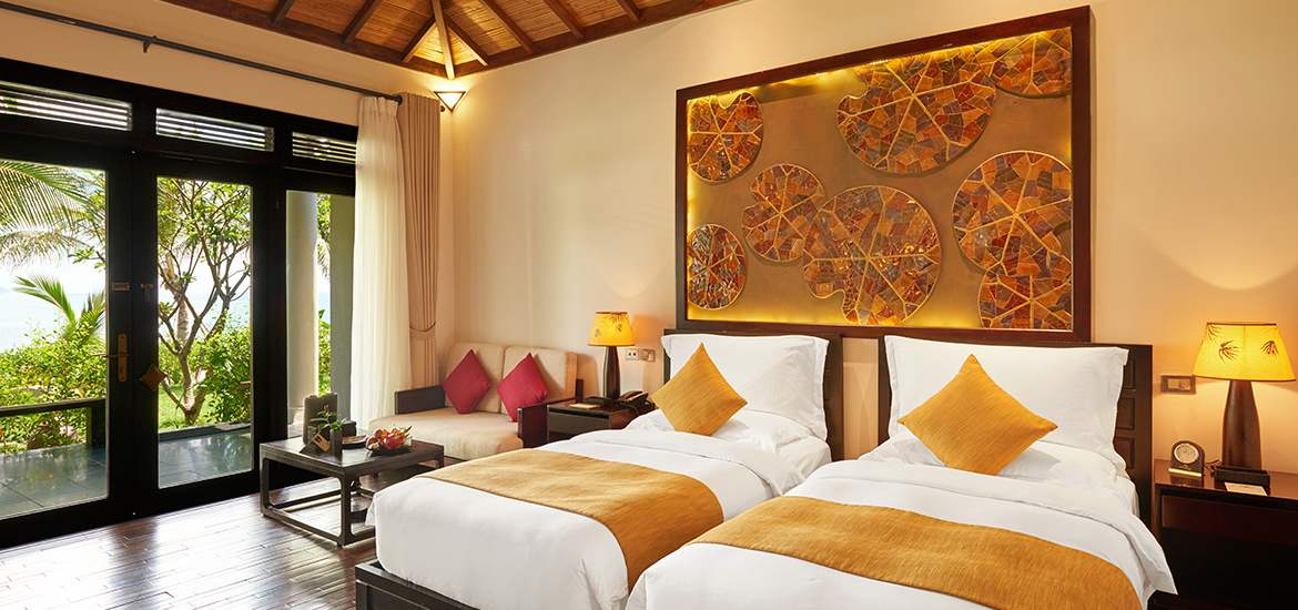 Ocean Deluxe room with warm yellow tones amiana resort nha trang review