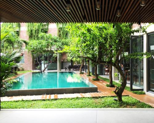 From the room, you can look out towards the clear swimming pool outside.